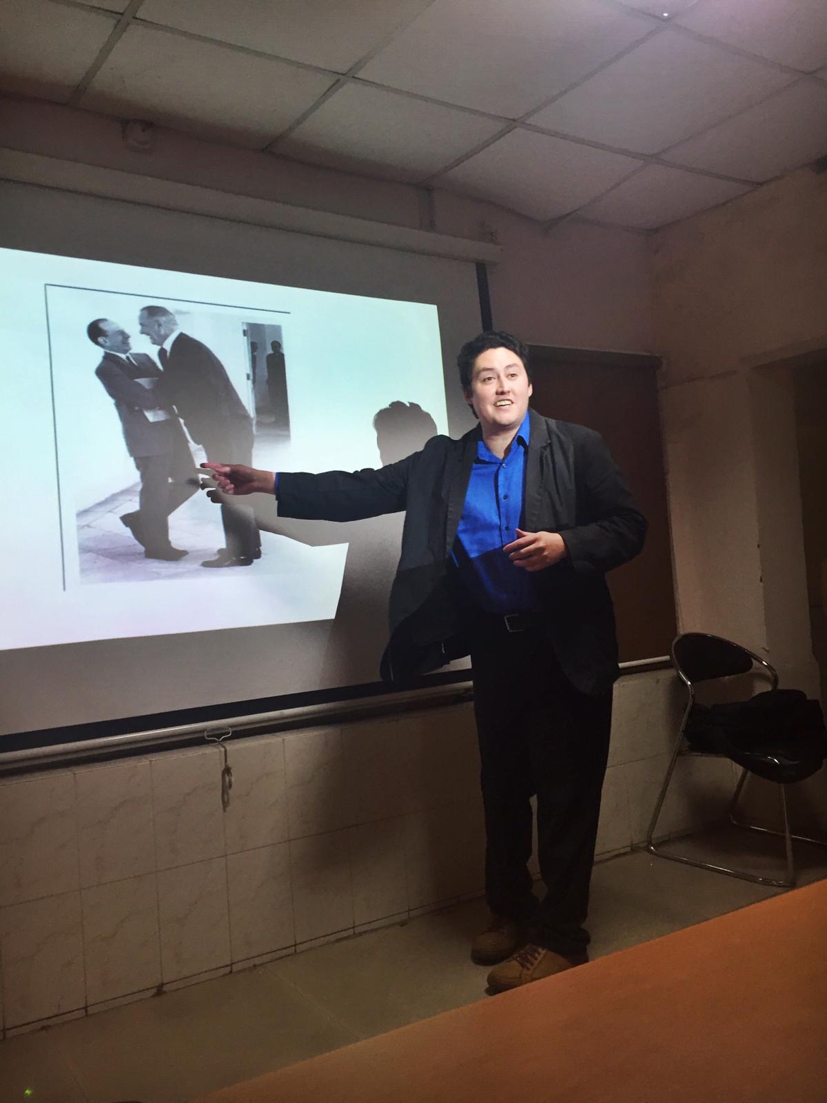 Pic of Marc elivering a lecture at Ambedkar University Delhi (located in New Delhi) about U.S. food aid to India during the 1960s