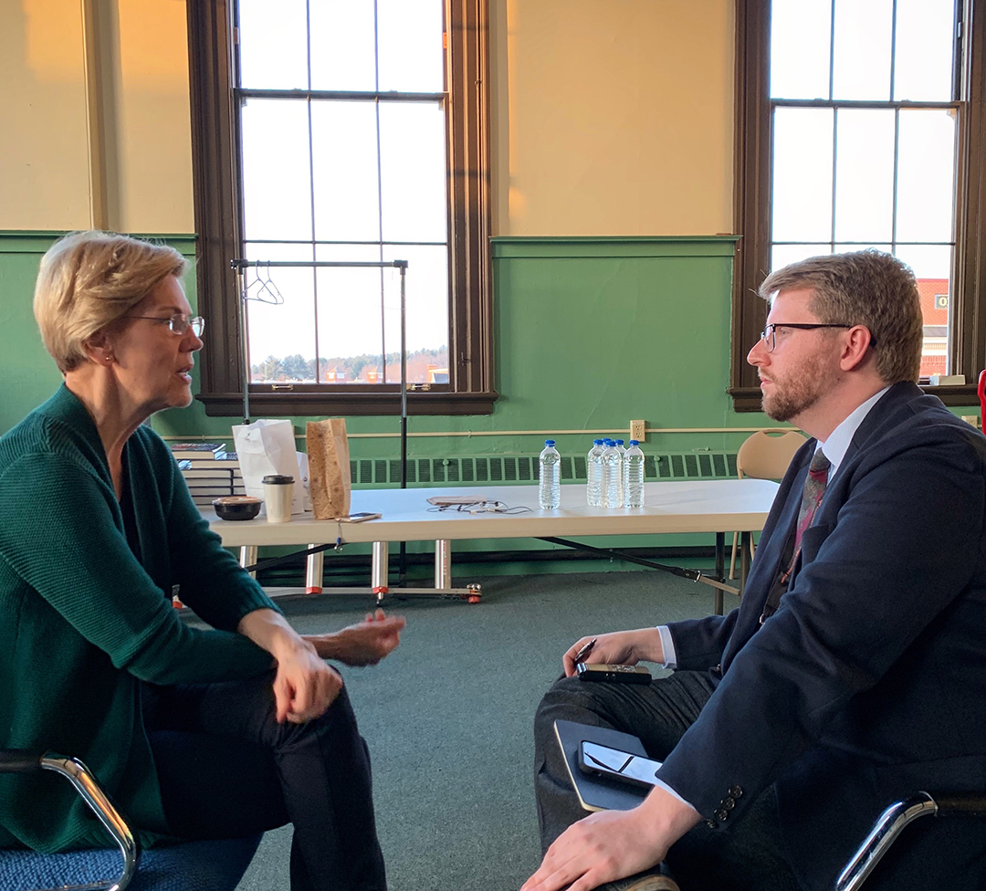 Associated Press reporter Hunter Woodall, BJ, BA history ’15, interviews Sen. Elizabeth Warren during the presidential candidate's recent visit to New Hampshire. 